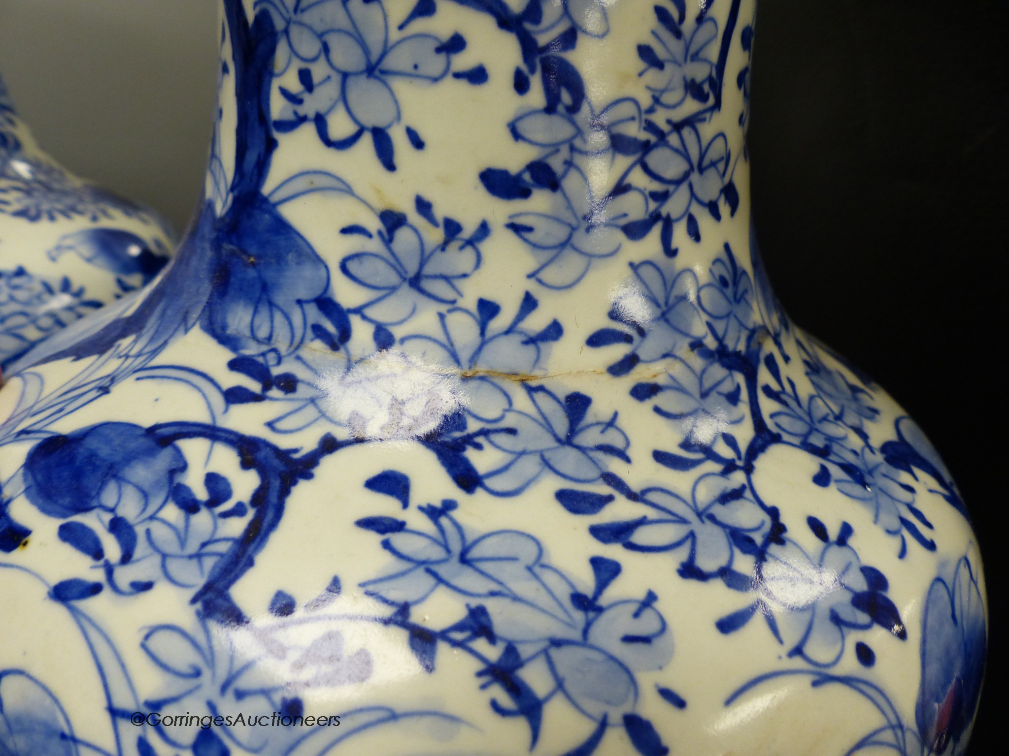 A pair of large Japanese blue and white vases (one a.f.), 60cm high